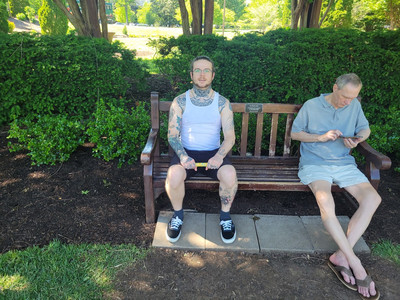 Sitting on Taylor Swift bench next to a guy listening to a podcast.jpg